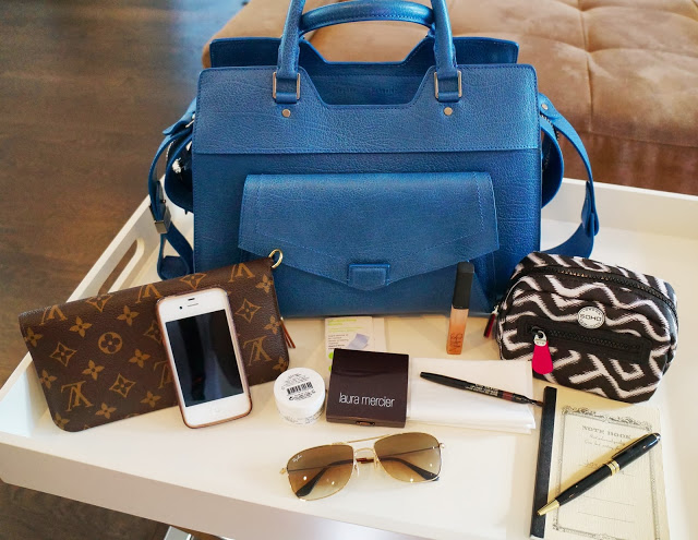 My blue proenza schouler with its contents in front of it