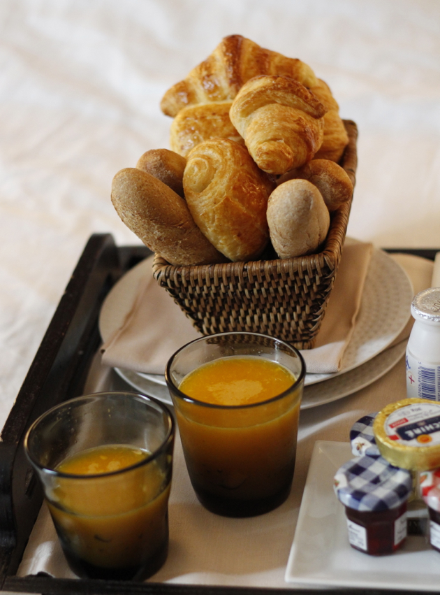 close-up of breakfast basket of rolls and croissants