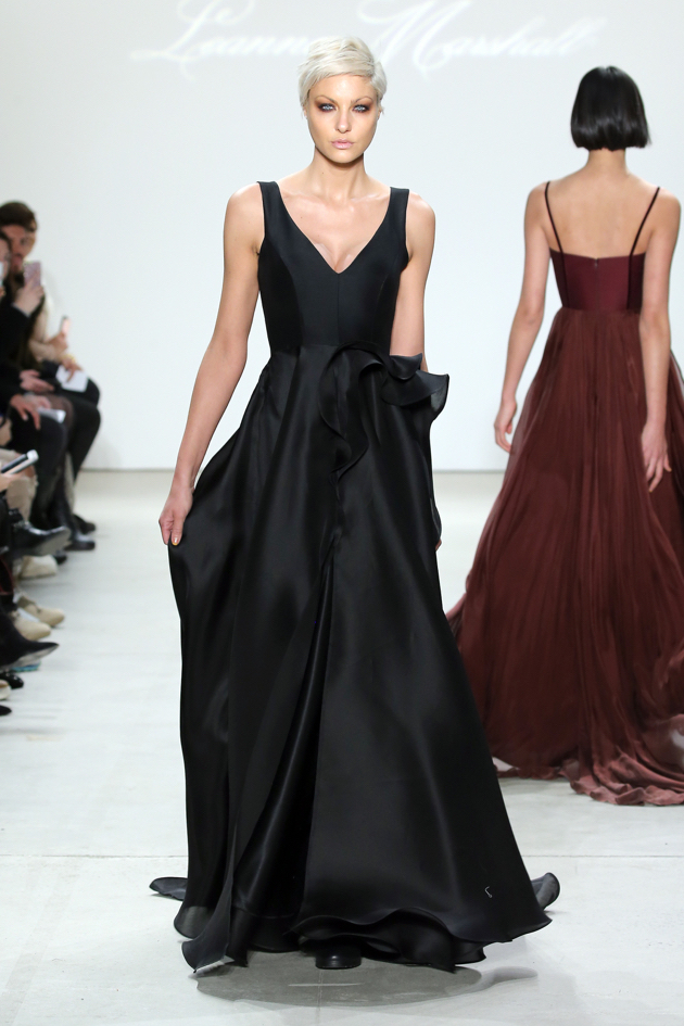 black plunging v-neck gown with architectural detail at waist