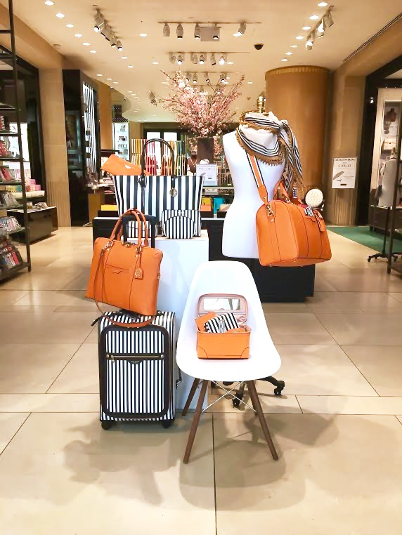 Luggage set in orange and classic brown and white stripe