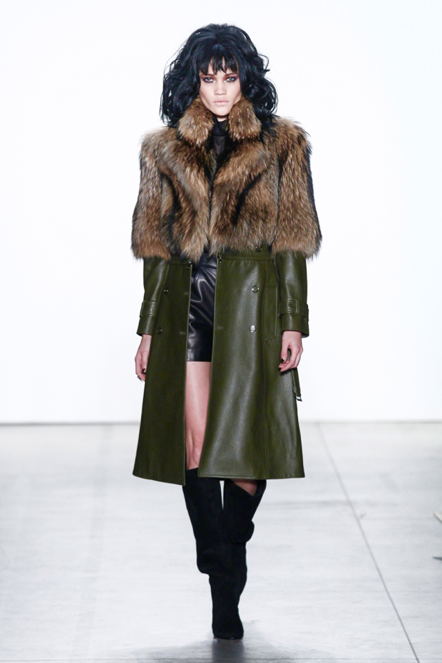 GEORGINE Fall/Winter 2017 - model walks with army green leather coat and fur topper