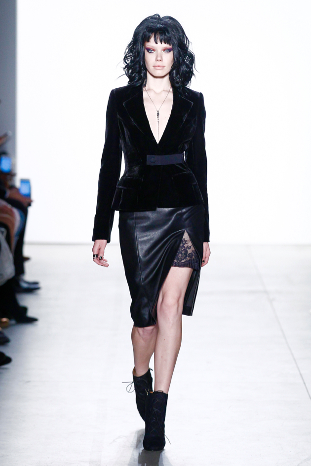 Sleek velvet blazer with black leather skirt with side-slit and peekaboo lace